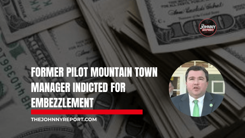 The Johnny Report news graphic featuring former Pilot Mountain Town Manager Michael Boaz, who was indicted on a felony embezzlement charge in May 2026.